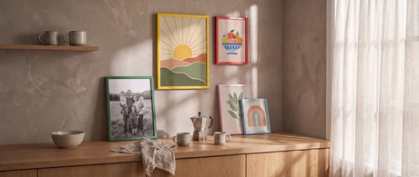 Colorful wood picture frames in yellow, red, green, pink and light blue in a sunlit kitchen coffee corner