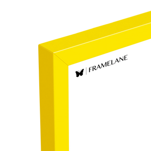 Yellow wood picture frame, top corner detail showing the profile